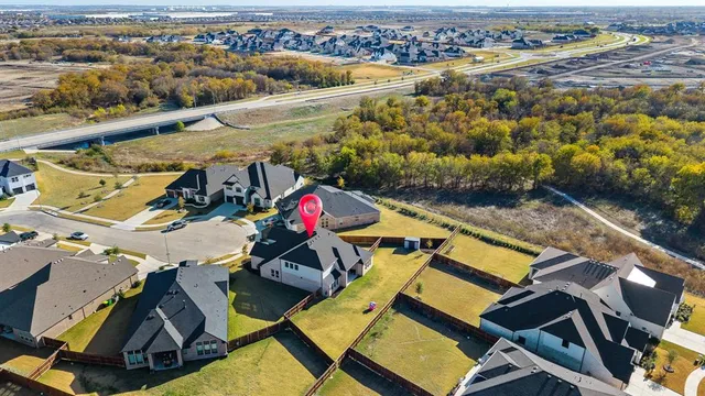 an aerial view of a house with a ocean view