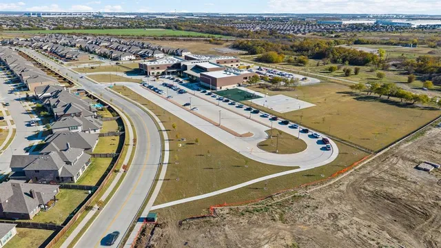 an aerial view of a house with outdoor space