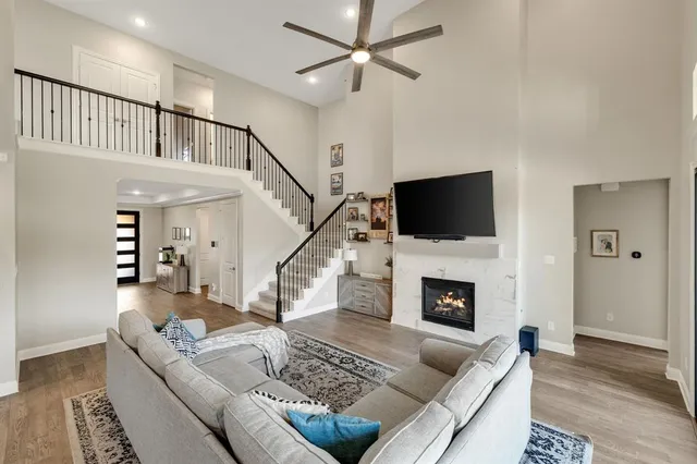 a living room with furniture fireplace and flat screen tv