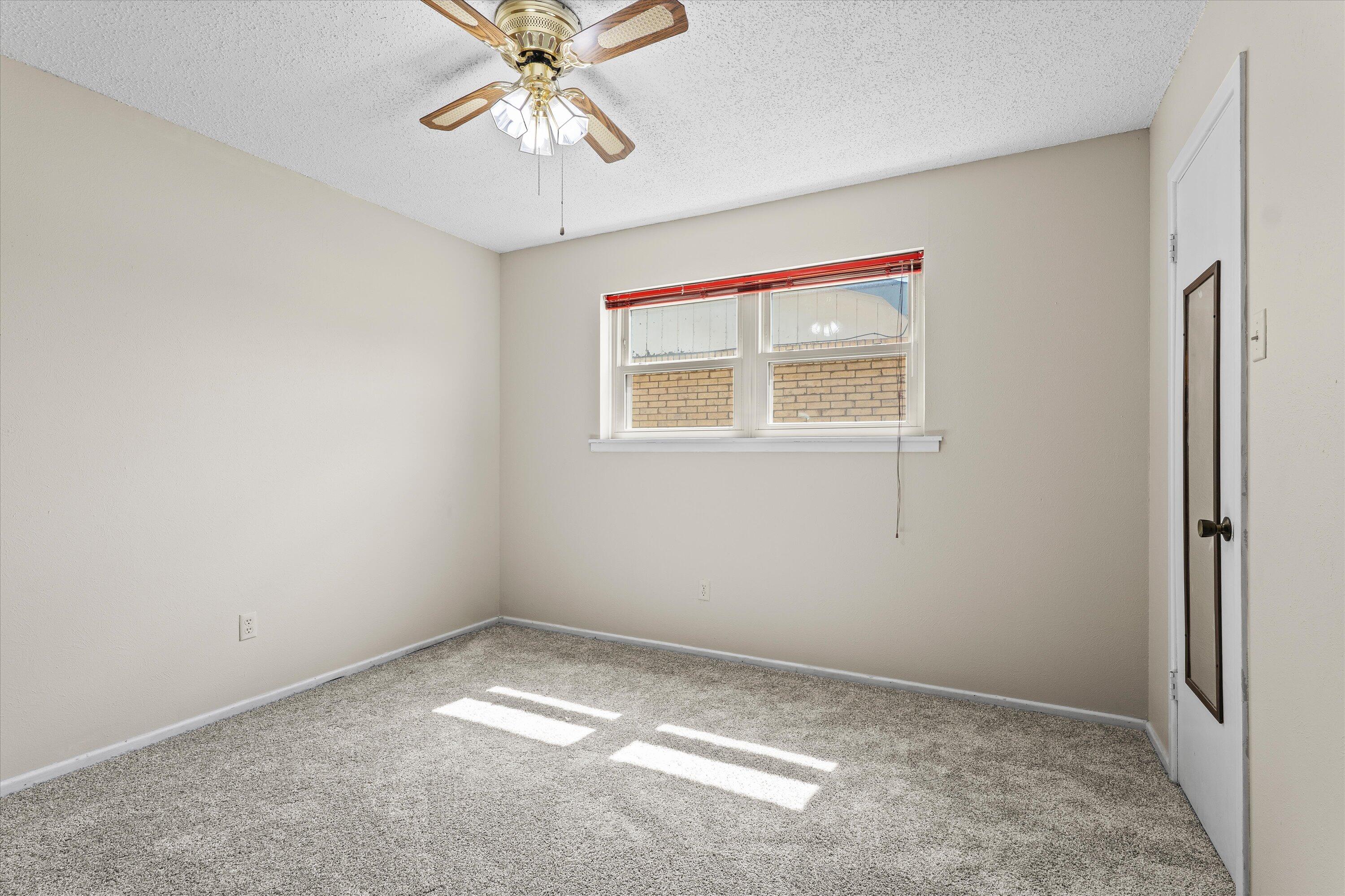 4520 54th Street Lubbock, TX 79414 - Photo 22 of 32 an empty room with a window