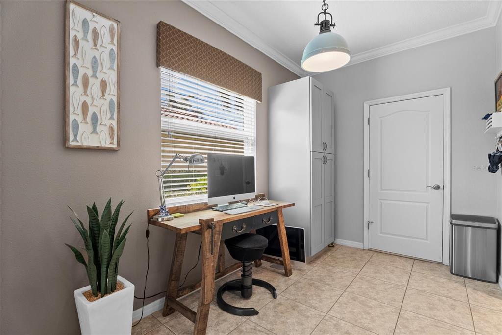 5439 Cartagena Drive Sarasota, FL 34233 - Photo 16 of 40 a view of a workspace with furniture and a window