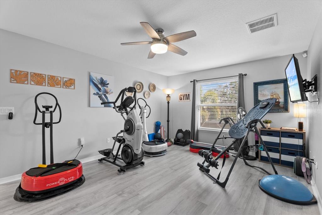5439 Cartagena Drive Sarasota, FL 34233 - Photo 26 of 40 a view of a room with gym equipment