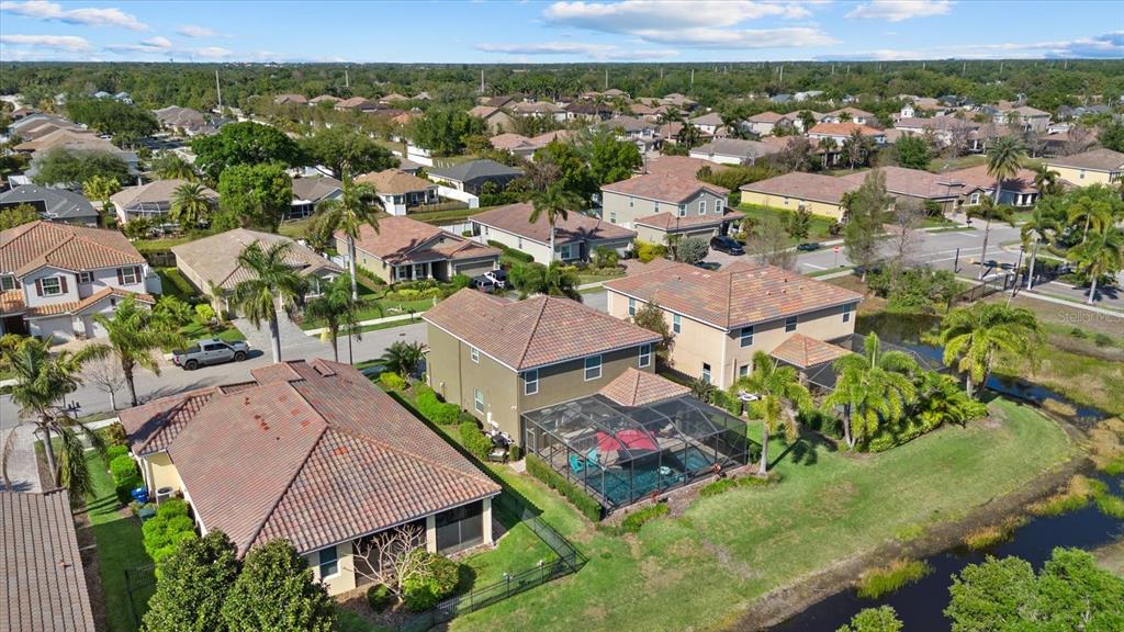 5439 Cartagena Drive Sarasota, FL 34233 - Photo 28 of 40 an aerial view of residential houses with outdoor space and parking