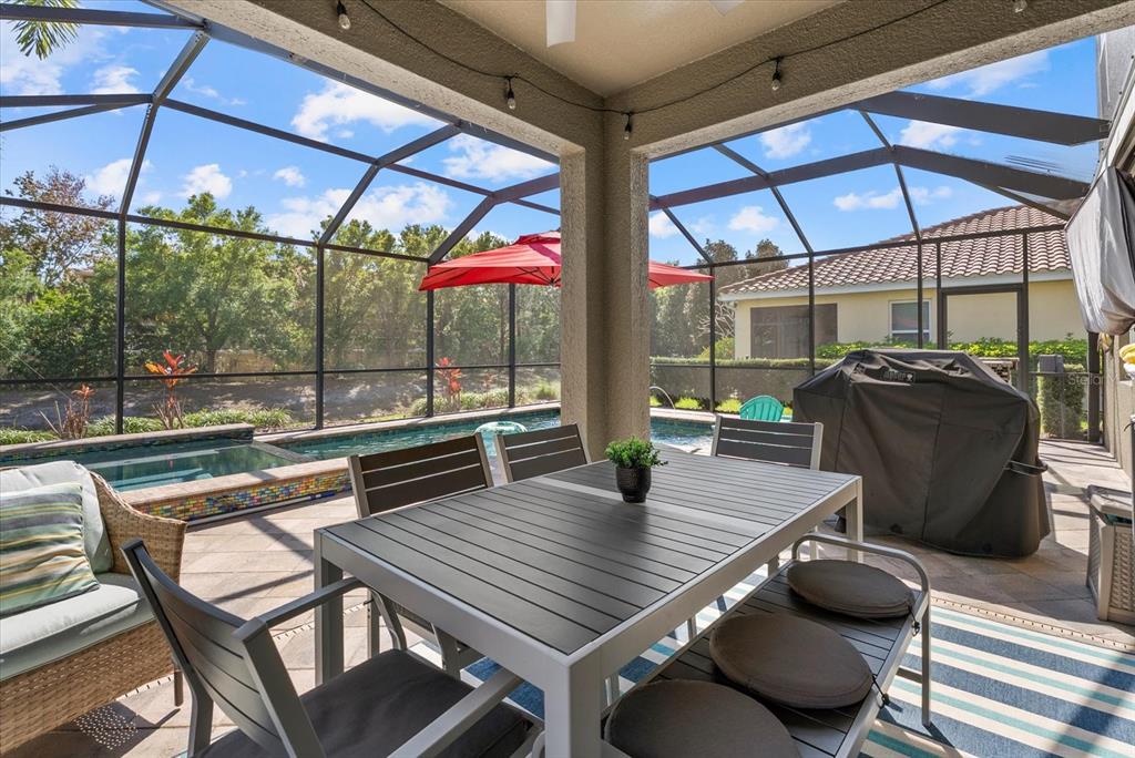 5439 Cartagena Drive Sarasota, FL 34233 - Photo 31 of 40 a outdoor dining space with furniture
