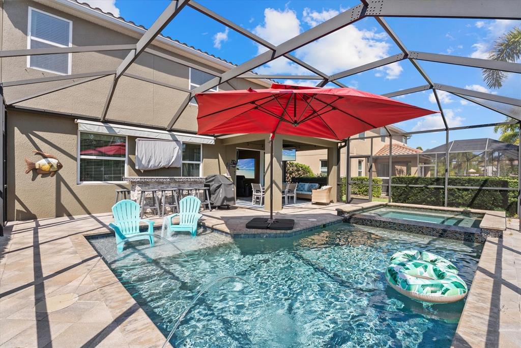 5439 Cartagena Drive Sarasota, FL 34233 - Photo 32 of 40 a view of a backyard with sitting area and furniture