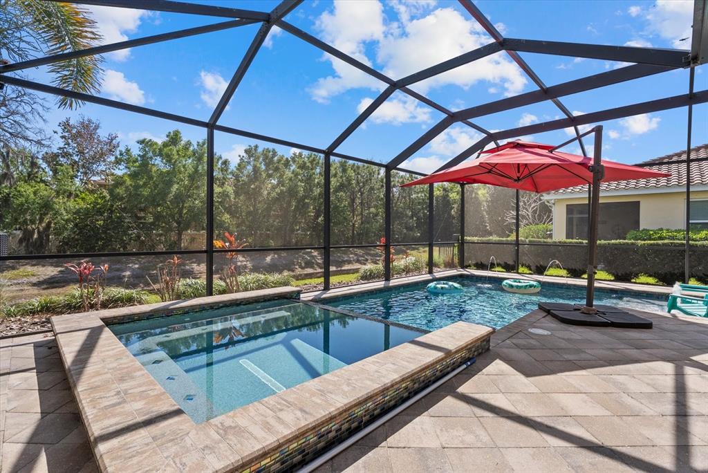 5439 Cartagena Drive Sarasota, FL 34233 - Photo 33 of 40 a view of a swimming pool with a patio