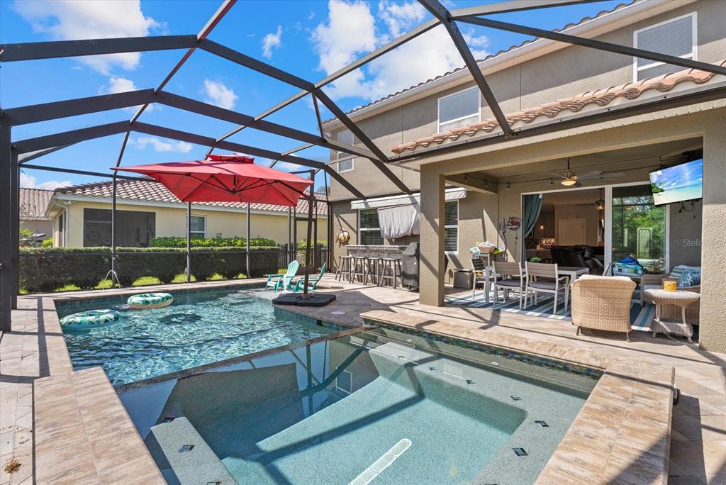 5439 Cartagena Drive Sarasota, FL 34233 - Photo 34 of 40 a view of backyard with swimming pool and table