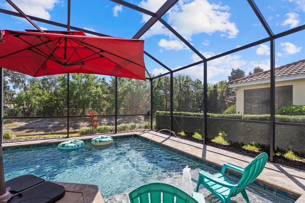 5439 Cartagena Drive Sarasota, FL 34233 - Photo 35 of 40 a view of a two chairs in the patio