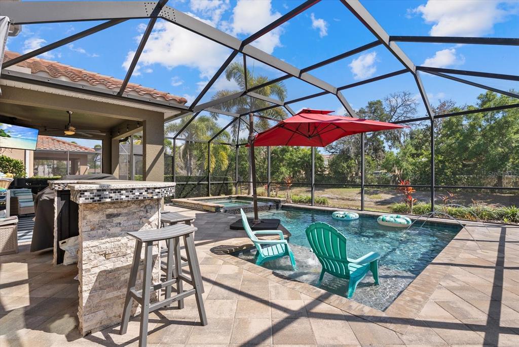 5439 Cartagena Drive Sarasota, FL 34233 - Photo 36 of 40 a view of a backyard with sitting area
