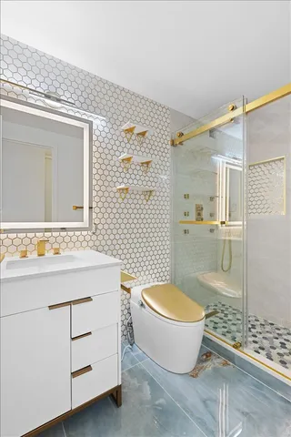 a bathroom with a toilet a sink and a mirror