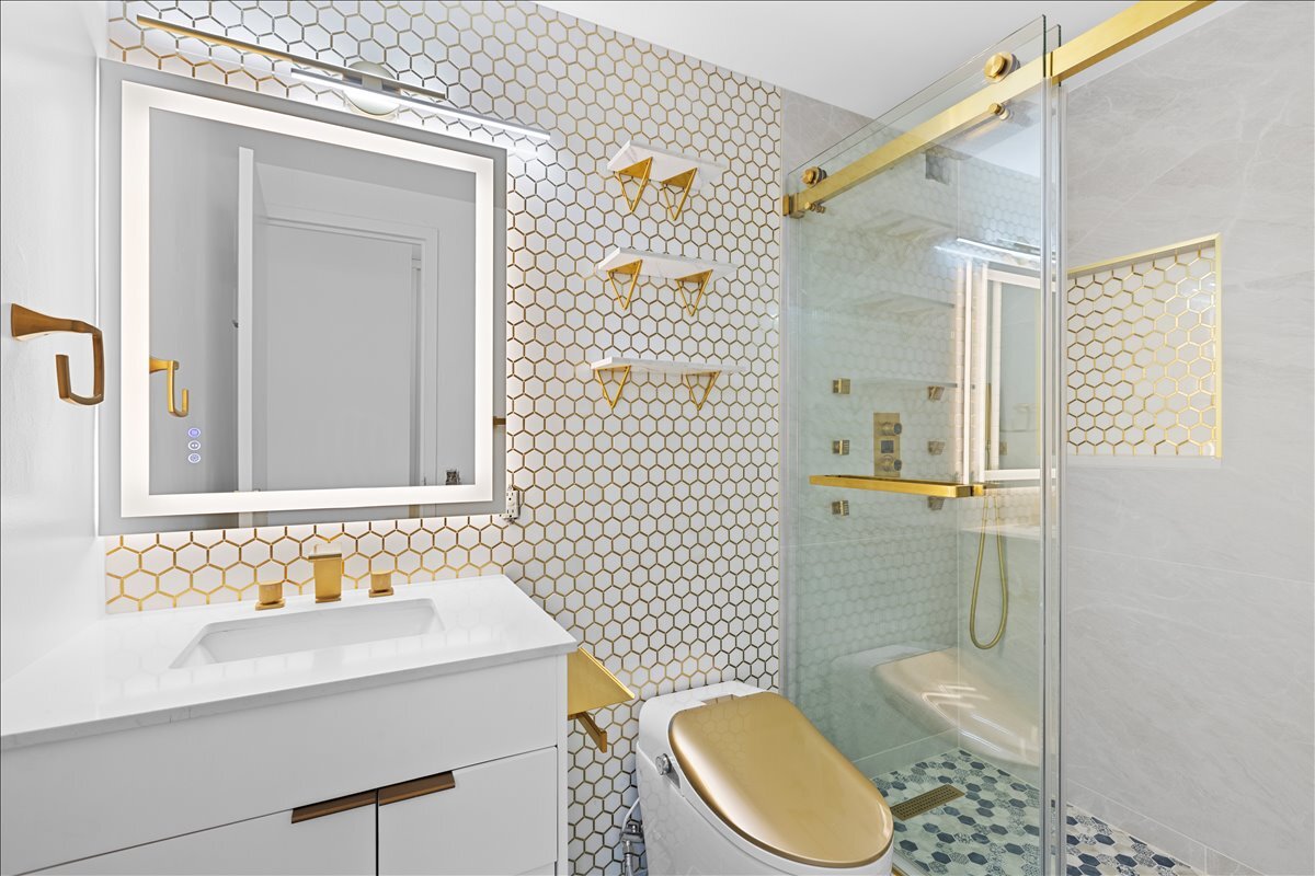 4343 North Clarendon Avenue, Unit 2507 Chicago, IL 60613 - Photo 14 of 23 a bathroom with a sink a toilet and shower