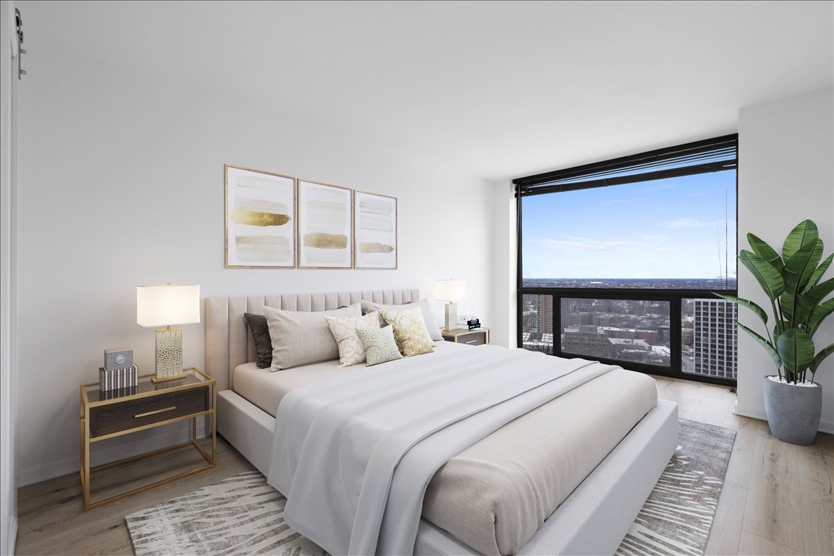 4343 North Clarendon Avenue, Unit 2507 Chicago, IL 60613 - Photo 15 of 23 a bedroom with a bed and a potted plant