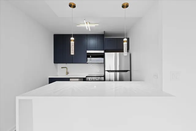 a en suite bathroom with a sink and a mirror