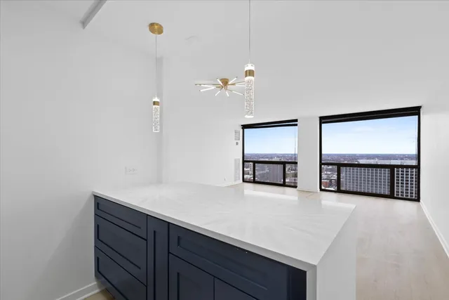 a view of a room with window and cabinet