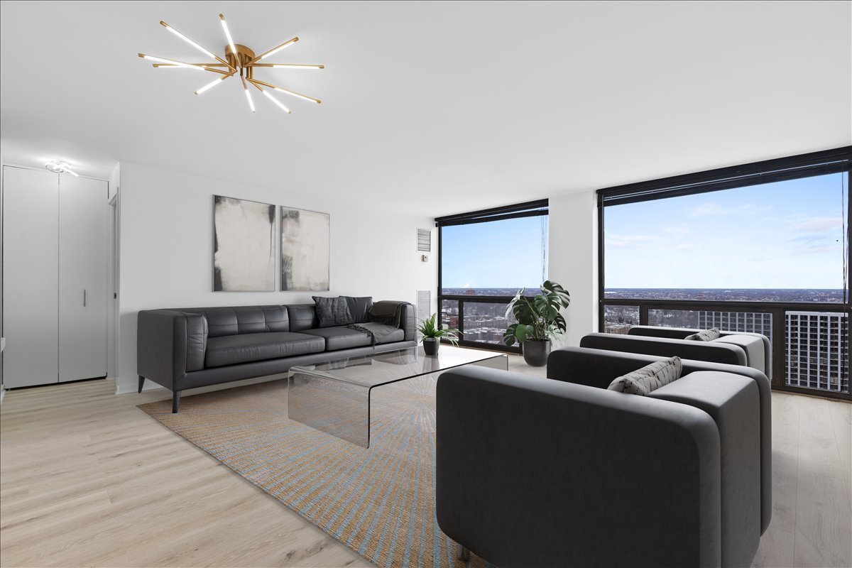 4343 North Clarendon Avenue, Unit 2507 Chicago, IL 60613 - Photo 7 of 23 a living room with furniture ceiling fan and a rug