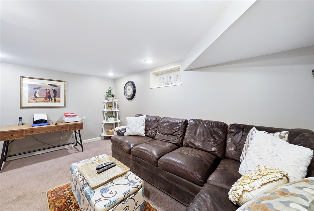 4 Wescott Road Stoneham, MA 02180 - Photo 28 of 42 a living room with furniture and a couch