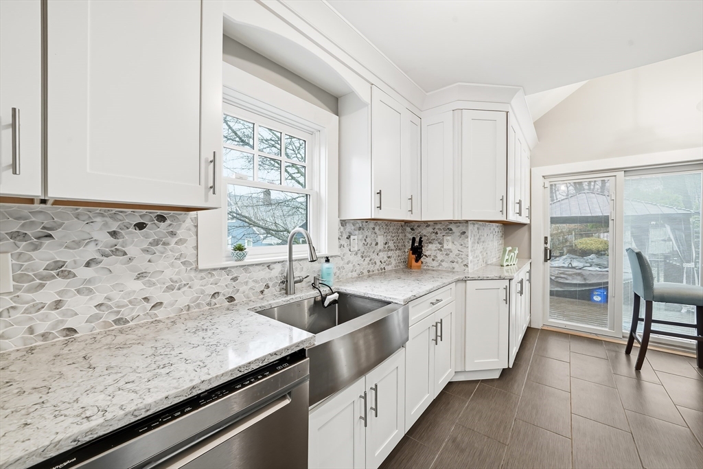 4 Wescott Road Stoneham, MA 02180 - Photo 3 of 42 a kitchen with a sink stove and cabinets