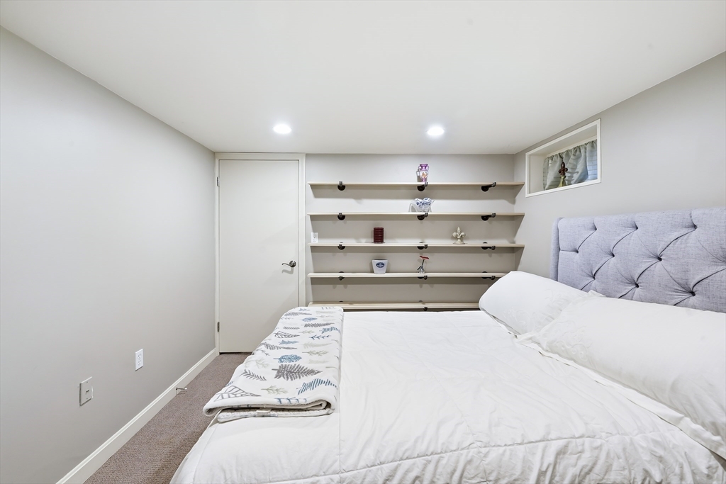 4 Wescott Road Stoneham, MA 02180 - Photo 32 of 42 a bedroom with a bed and window