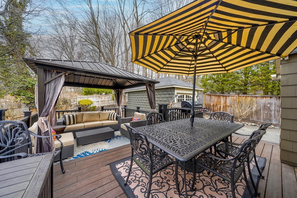 4 Wescott Road Stoneham, MA 02180 - Photo 35 of 42 a roof deck with a table and chairs