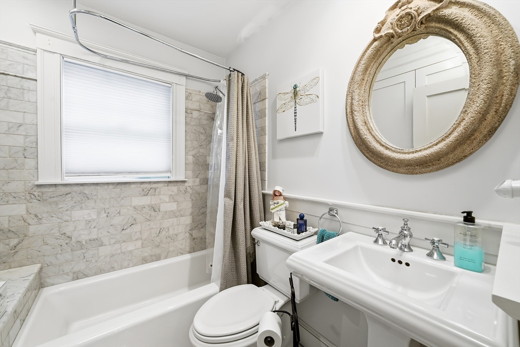4 Wescott Road Stoneham, MA 02180 - Photo 4 of 42 a bathroom with a sink a toilet and a bathtub