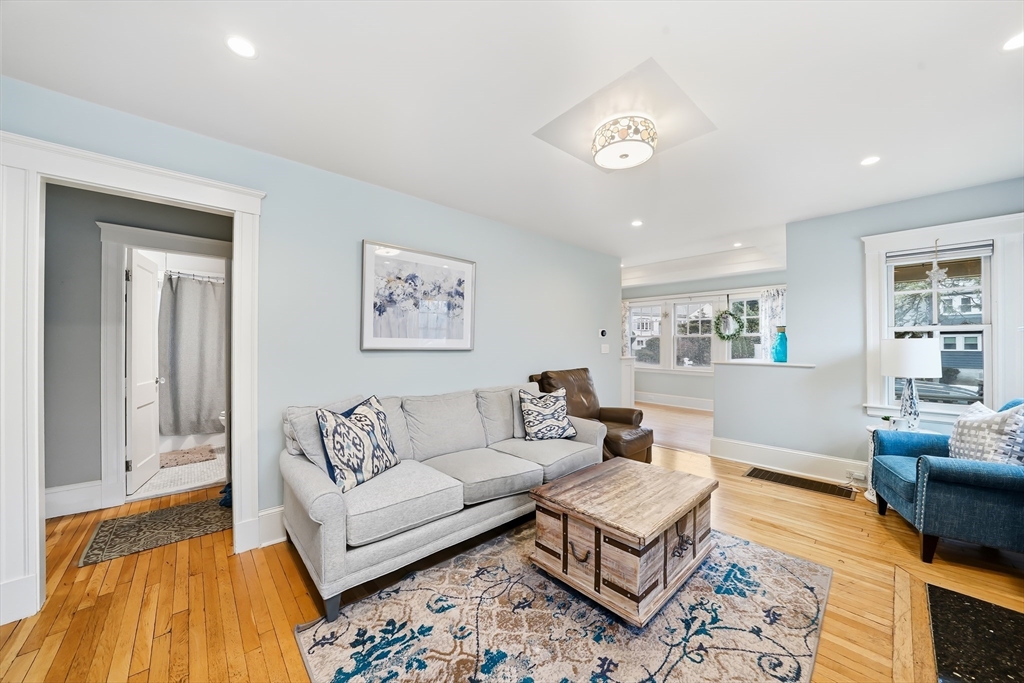 4 Wescott Road Stoneham, MA 02180 - Photo 7 of 42 a living room with furniture and a table