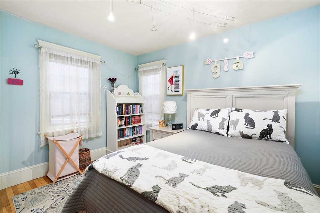 4 Wescott Road Stoneham, MA 02180 - Photo 10 of 42 a bedroom with a bed and a dresser in it