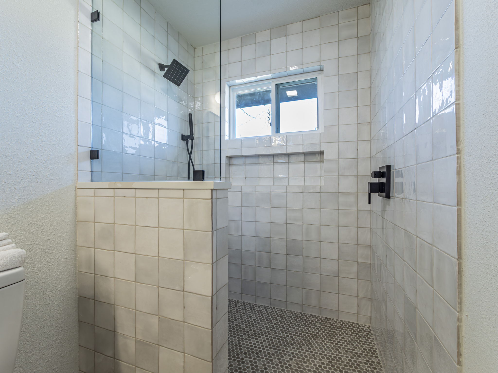 906 Fall Creek Drive Austin, TX 78753 - Photo 11 of 25 Full bathroom with walk in shower and a textured wall
