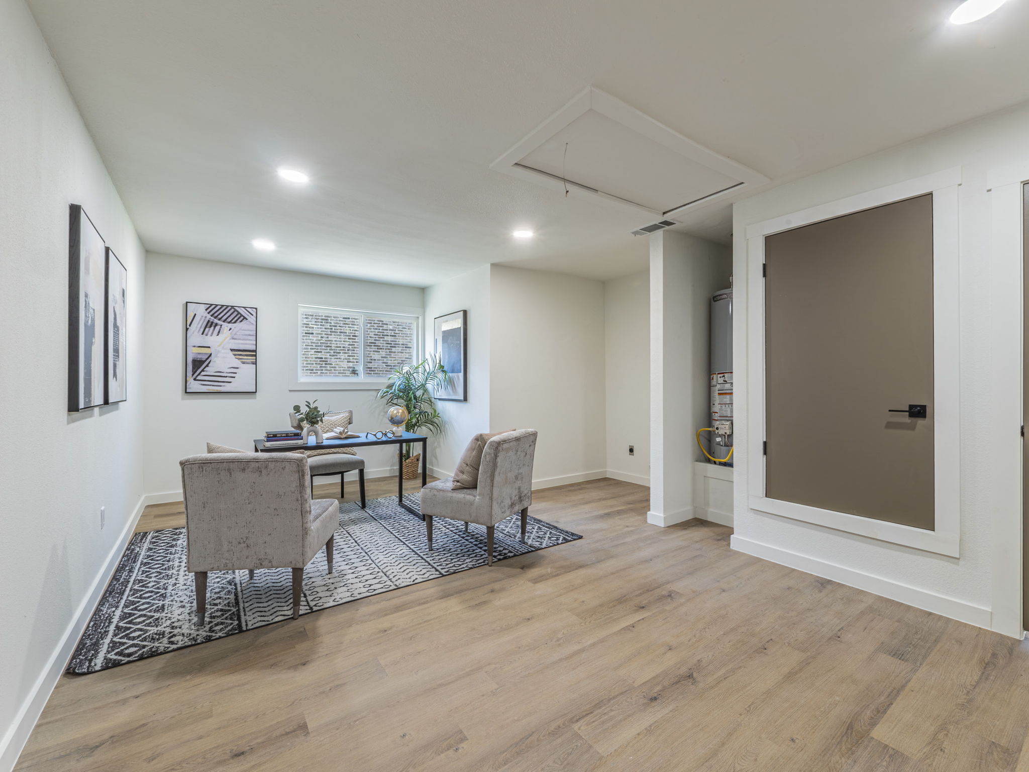 906 Fall Creek Drive Austin, TX 78753 - Photo 13 of 25 Office area with attic access, light wood-style floors, recessed lighting, and gas water heater