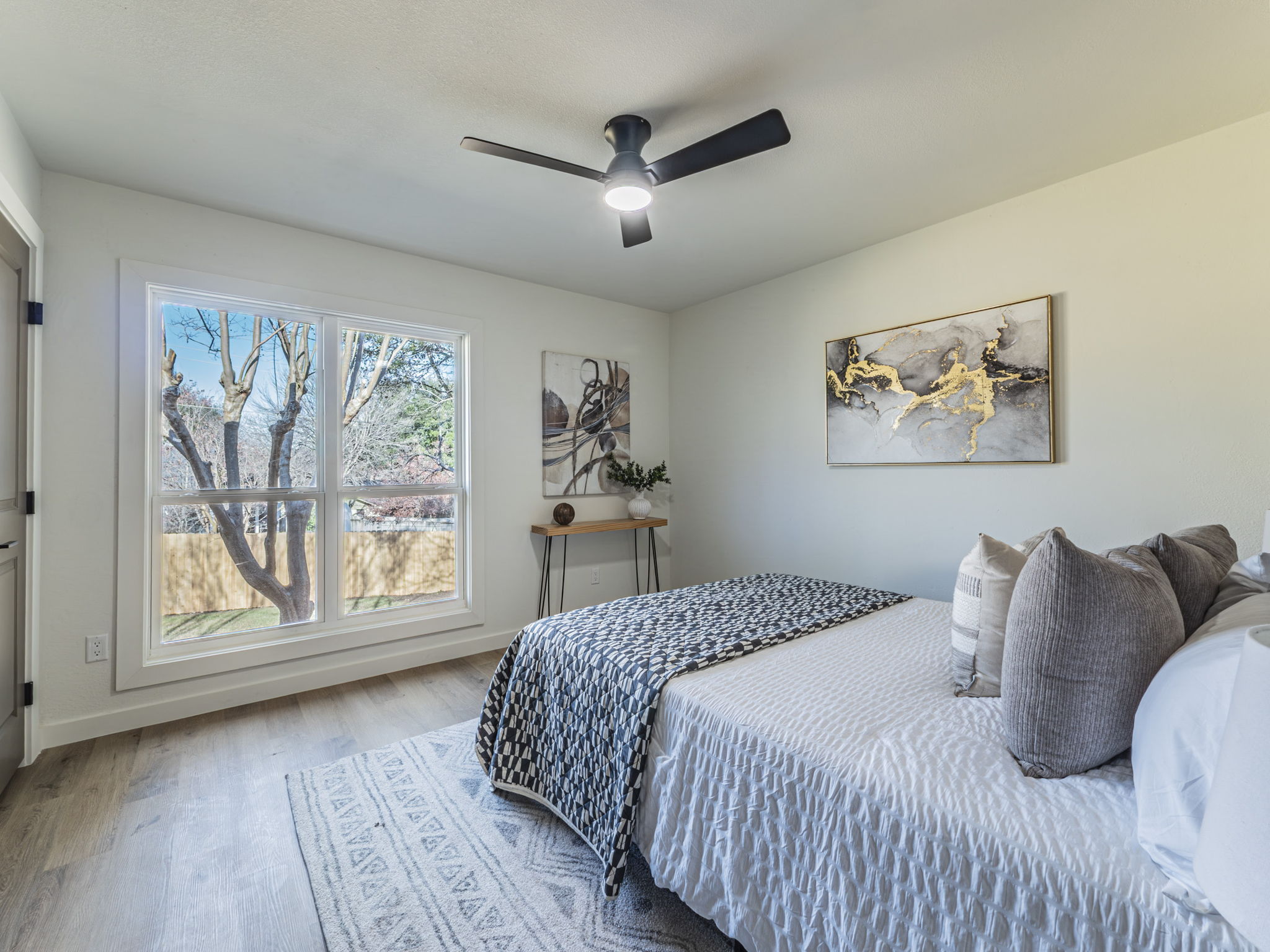 906 Fall Creek Drive Austin, TX 78753 - Photo 14 of 25 Bedroom with wood finished floors and ceiling fan