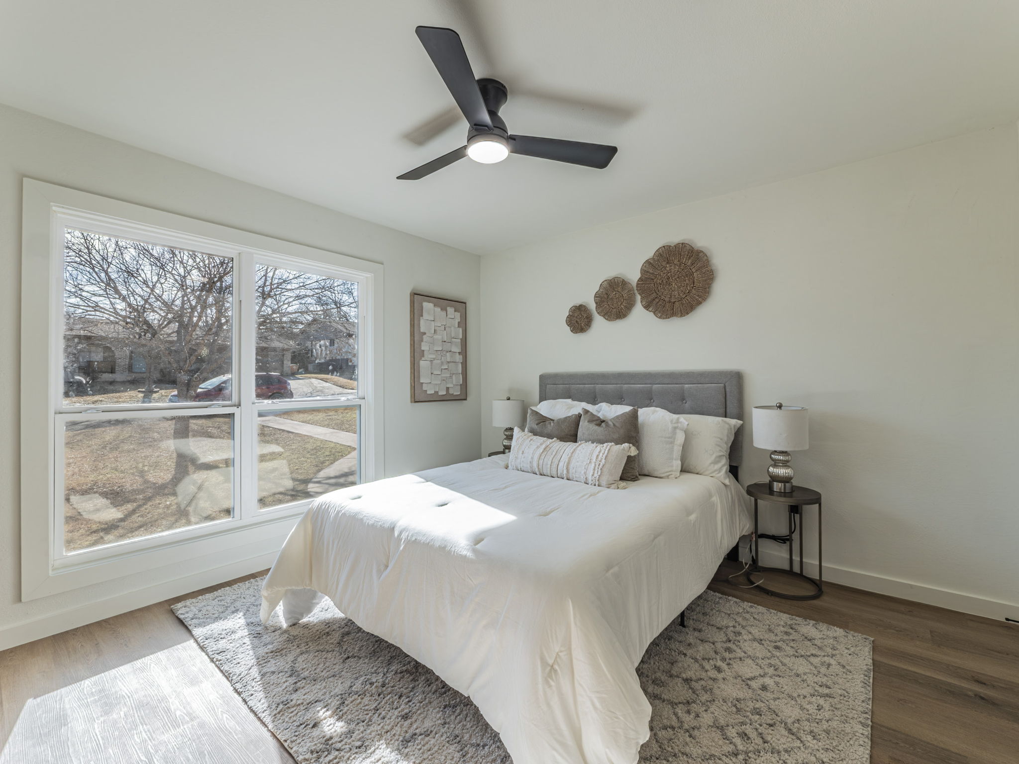 906 Fall Creek Drive Austin, TX 78753 - Photo 17 of 25 Bedroom featuring wood finished floors and a ceiling fan