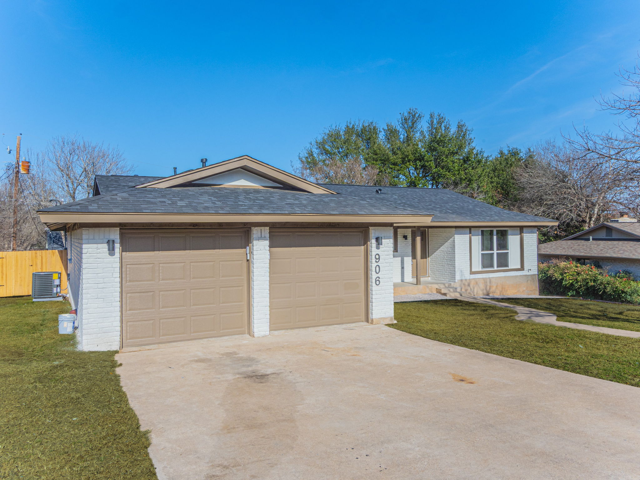 906 Fall Creek Drive Austin, TX 78753 - Photo 19 of 25 Ranch-style house with brick siding, driveway, and an attached garage