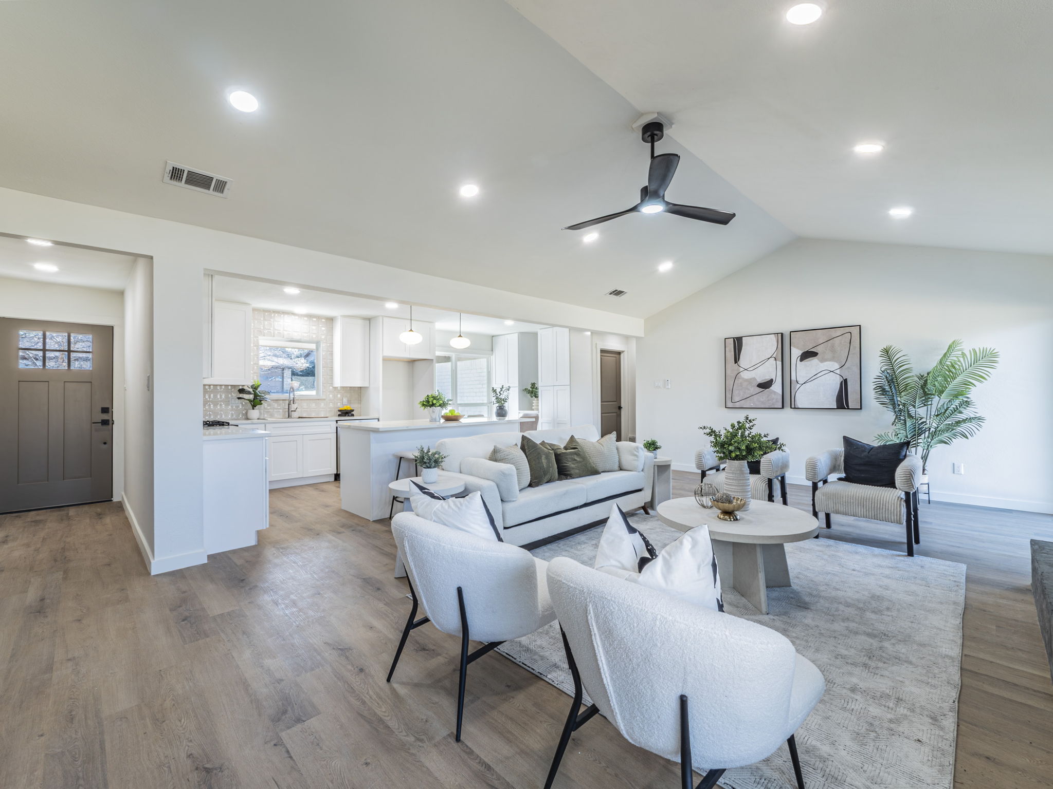 906 Fall Creek Drive Austin, TX 78753 - Photo 4 of 25 Living room featuring light wood finished floors, lofted ceiling, a ceiling fan, and recessed lighting