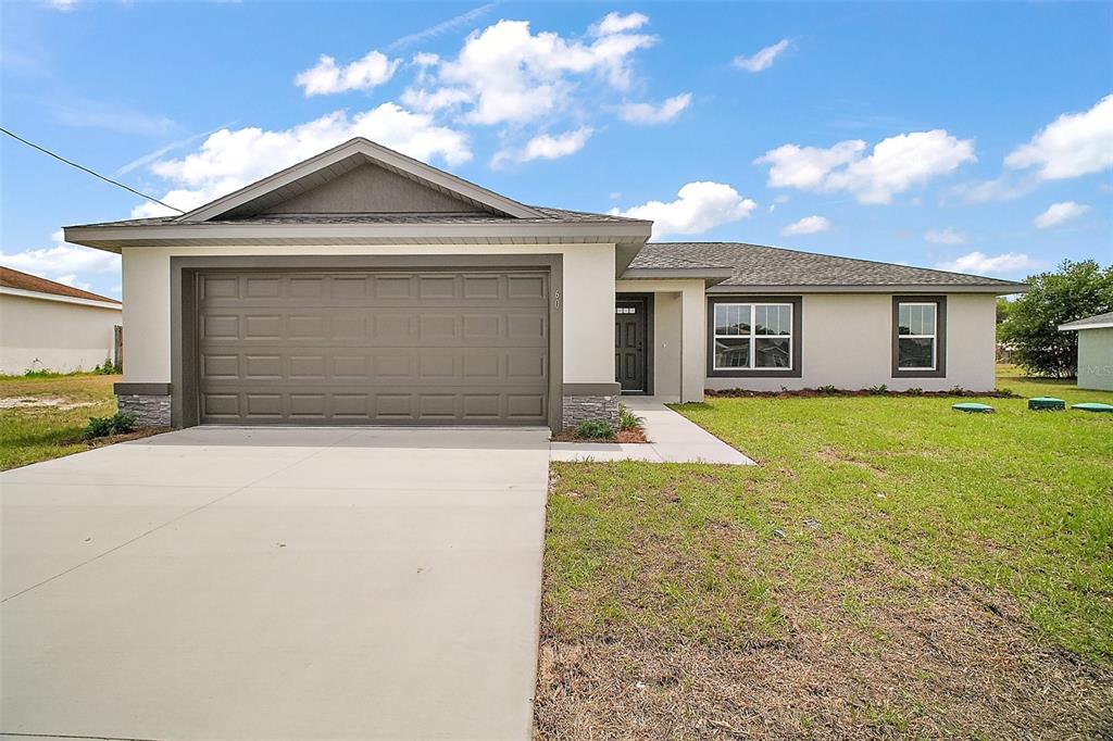 a front view of a house with yard