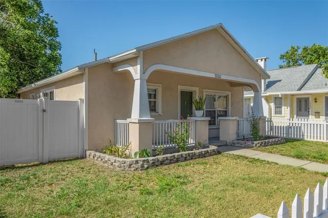 a view of a house with a small yard