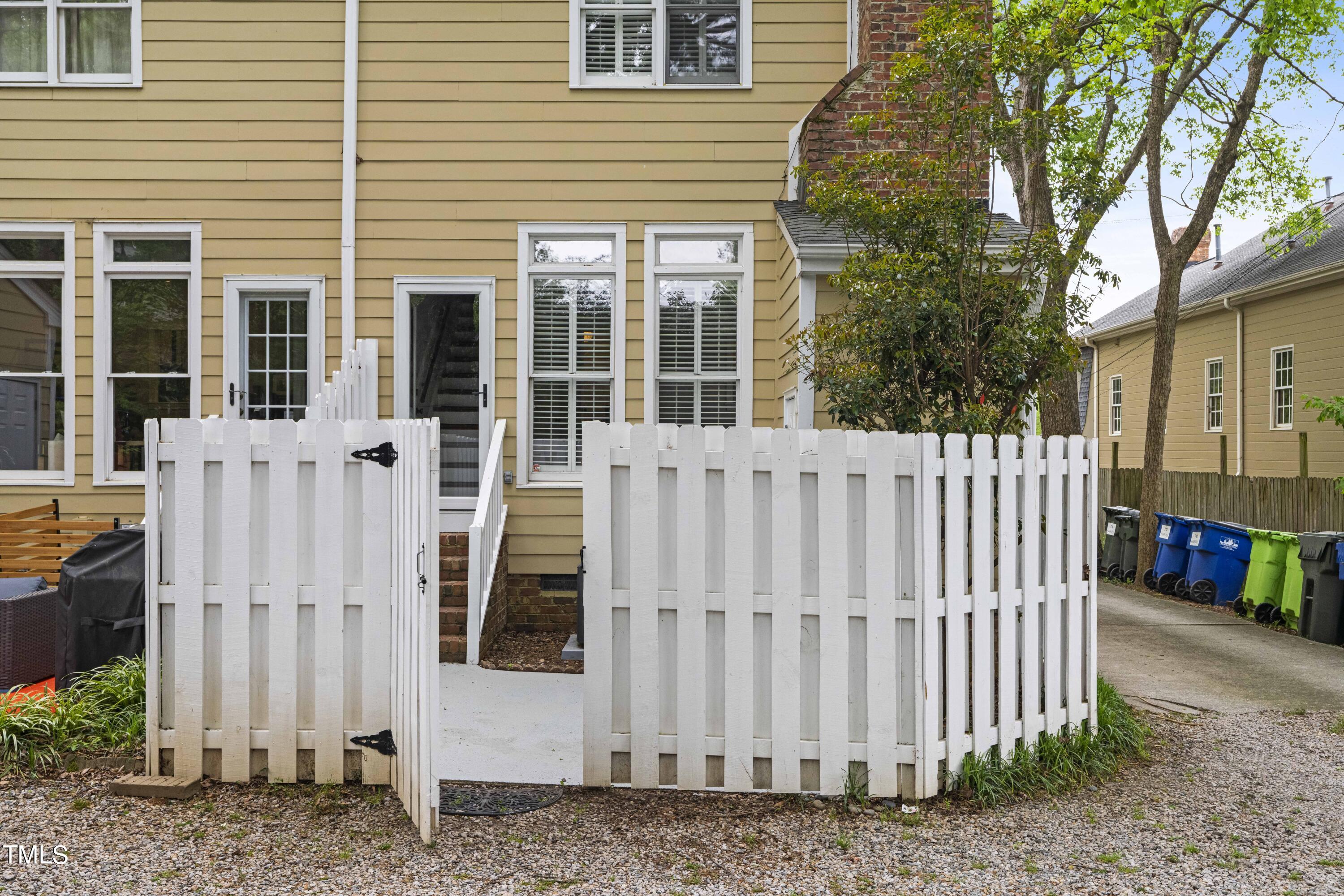 712 Harvey Street Raleigh, NC 27608 - Photo 19 of 23 712b patio gate open to house