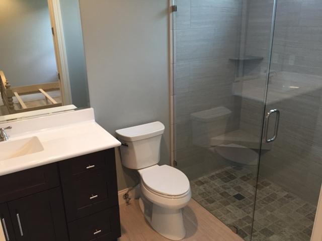 64 Chapman Street Santa Rosa Beach, FL 32459 - Photo 11 of 31 a white toilet sitting next to a bathroom sink