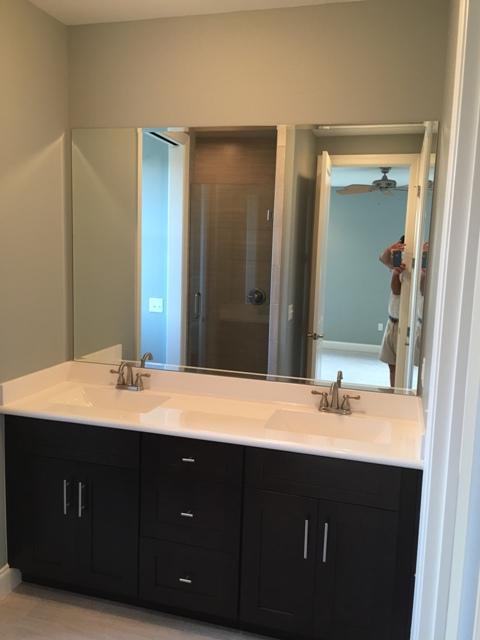 64 Chapman Street Santa Rosa Beach, FL 32459 - Photo 14 of 31 a bathroom with a double vanity sink and a mirror