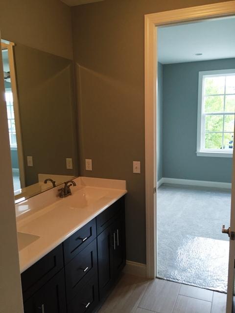 64 Chapman Street Santa Rosa Beach, FL 32459 - Photo 18 of 31 a bathroom with a sink vanity granite and a mirror