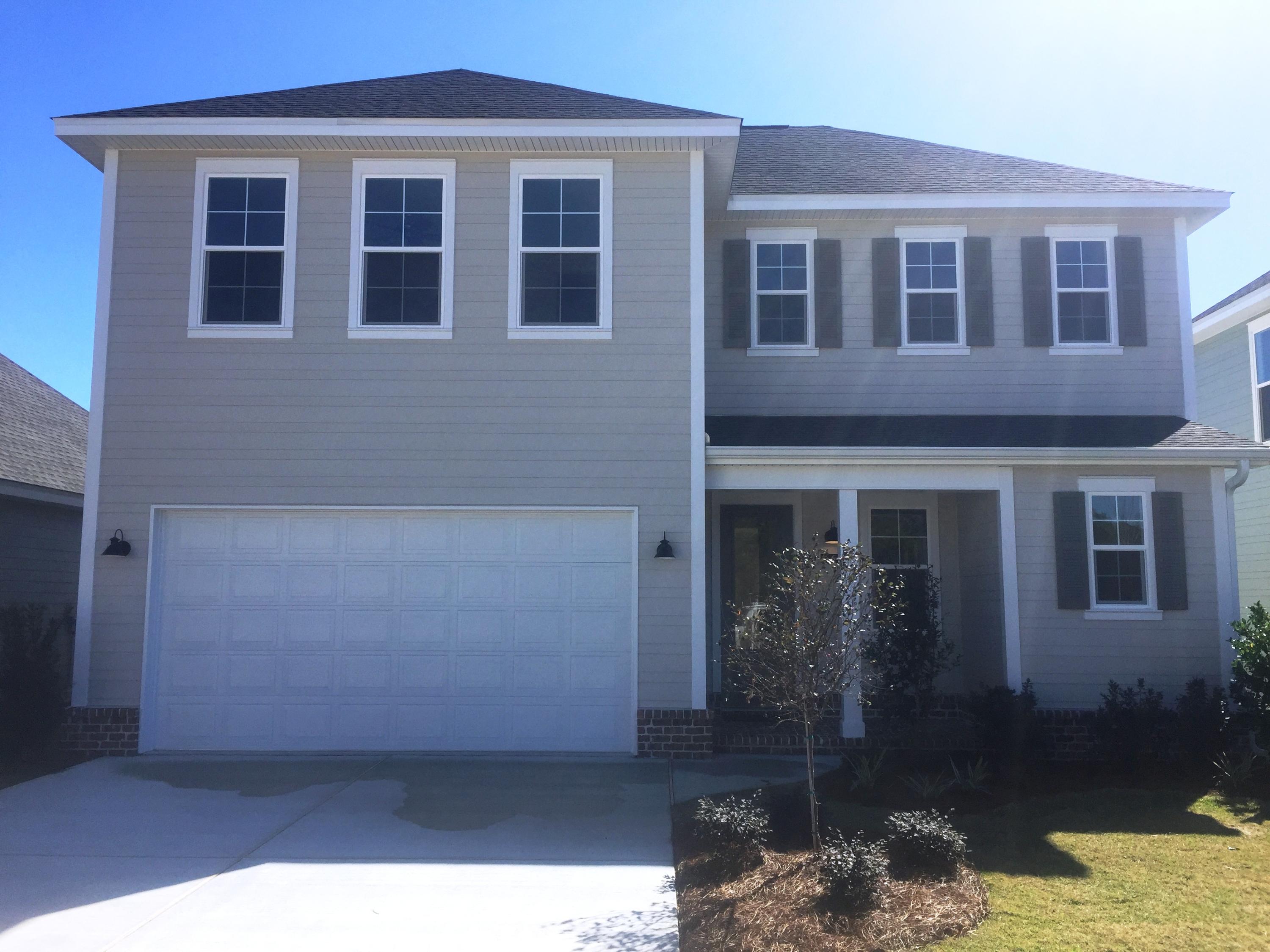 64 Chapman Street Santa Rosa Beach, FL 32459 - Photo 31 of 31 a front view of a house with a yard