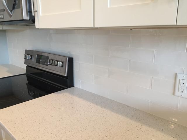 64 Chapman Street Santa Rosa Beach, FL 32459 - Photo 8 of 31 a kitchen with a white cabinets