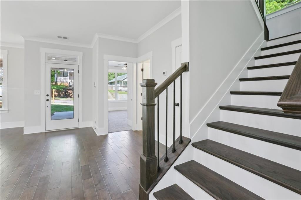 992 Coleman Street Southwest Atlanta, GA 30310 - Photo 11 of 18 a view of staircase with wooden floor and a rug