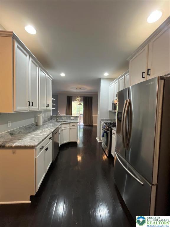 4224 Creek Road Allentown, PA 18104 - Photo 3 of 17 a kitchen with stainless steel appliances granite countertop a refrigerator a sink and a stove