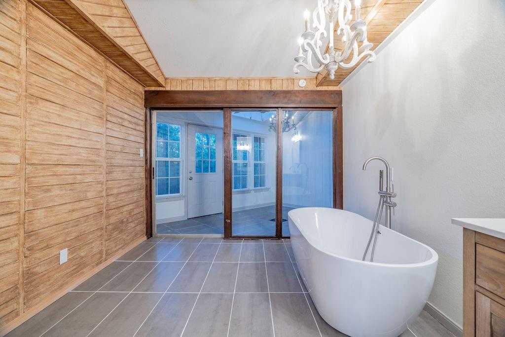 598 Stagecoach Trail Denison, TX 75021 - Photo 14 of 29 a bathroom with a bathtub and shower