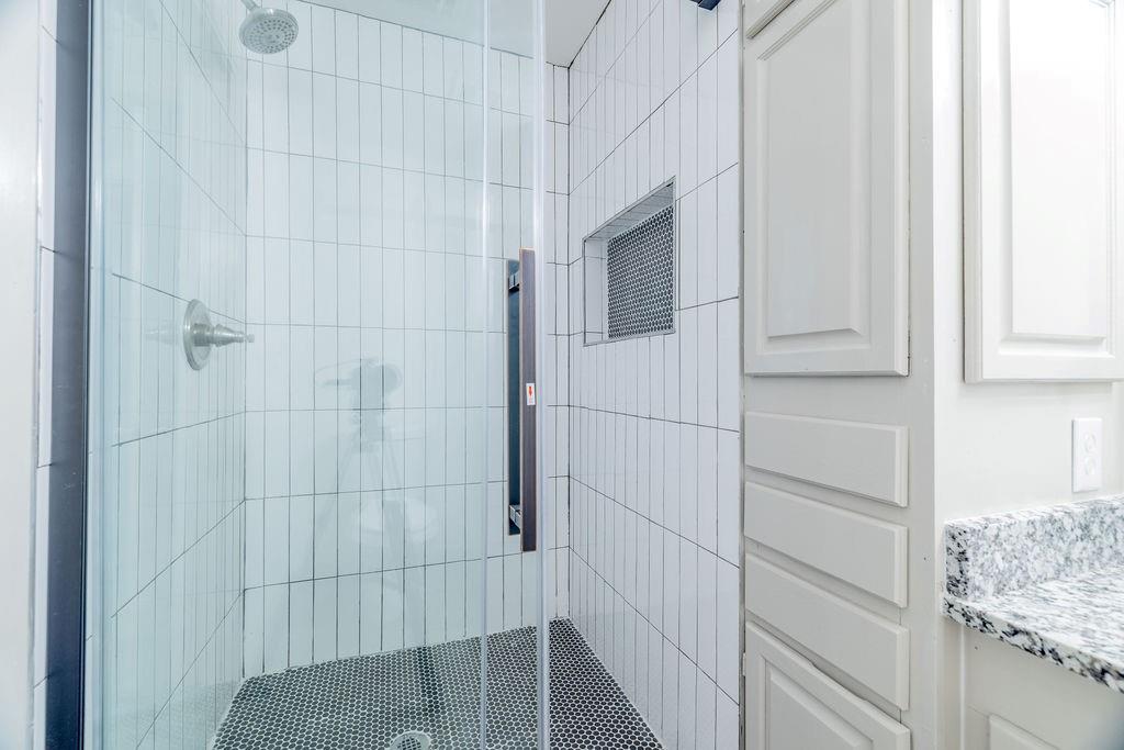 598 Stagecoach Trail Denison, TX 75021 - Photo 15 of 29 a bathroom with a shower