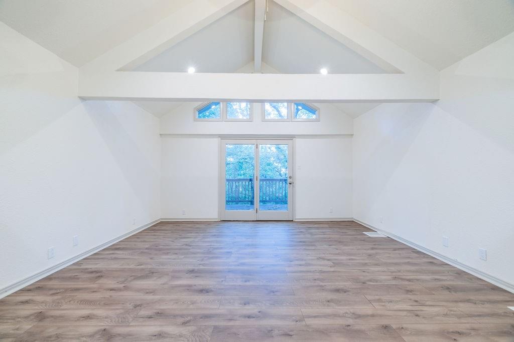 598 Stagecoach Trail Denison, TX 75021 - Photo 23 of 29 an empty room with wooden floor and windows