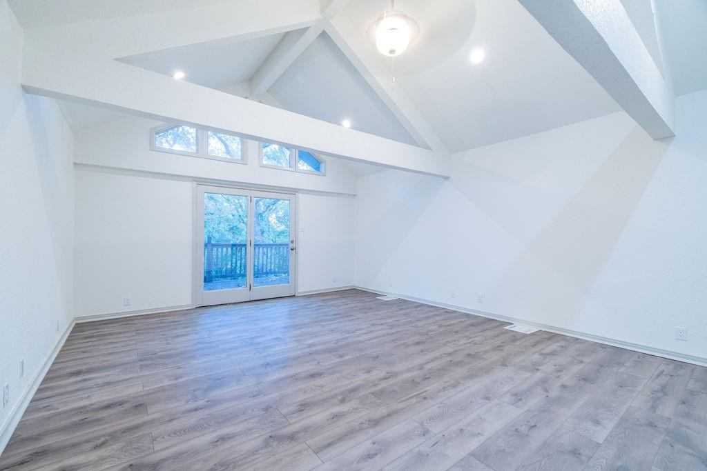 598 Stagecoach Trail Denison, TX 75021 - Photo 24 of 29 wooden floor in an empty room with a window