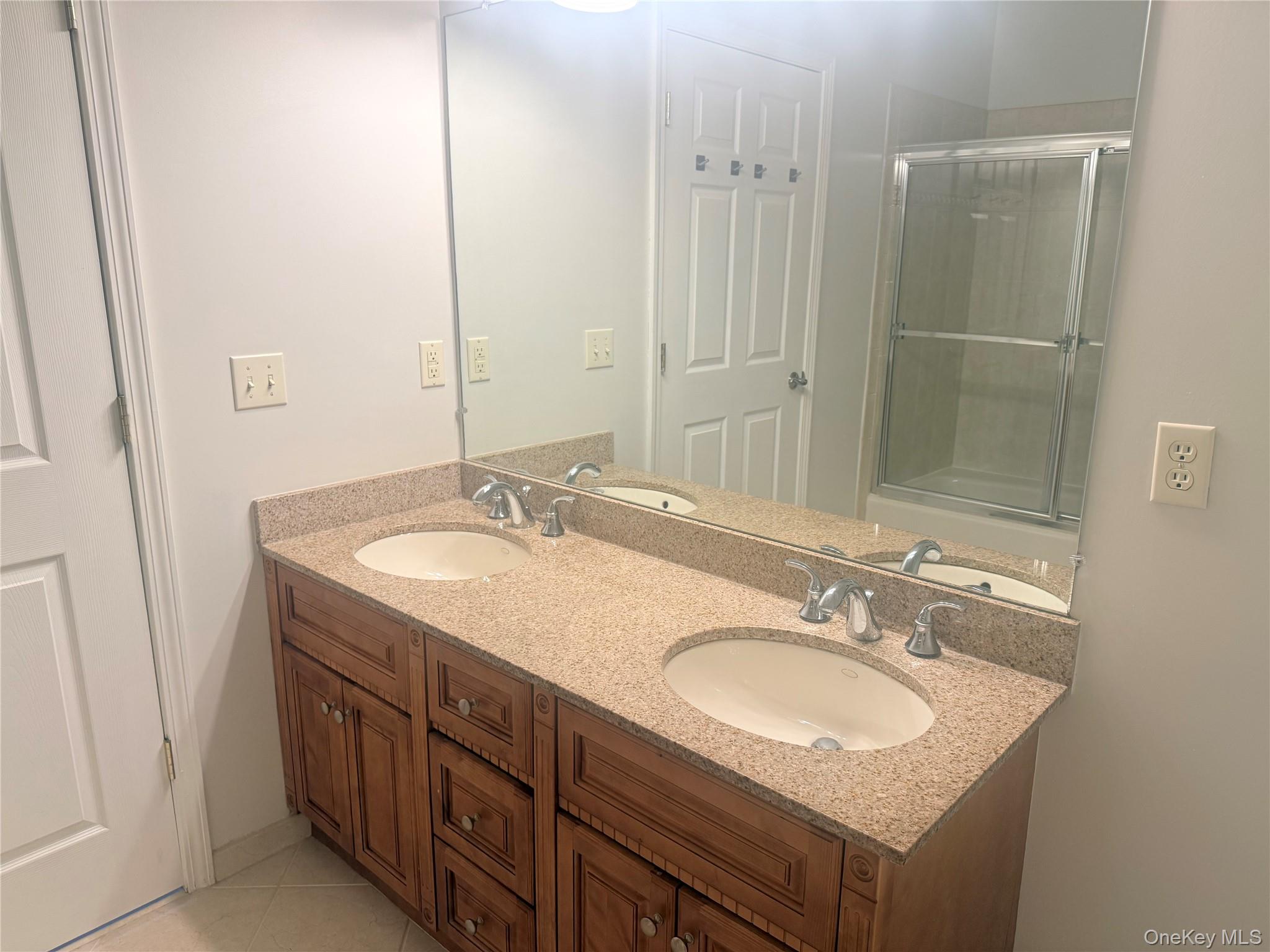 935 Tower Ridge Circle Middletown, NY 10941 - Photo 8 of 24 Double vanity with granite-finish countertop, dual integrated sinks, and chrome fixtures