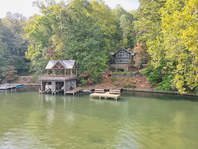 a view of house with outdoor space and swimming pool