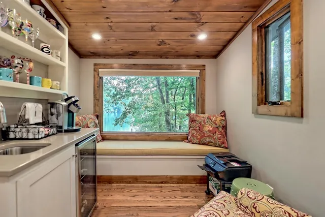 a bedroom with furniture and a window
