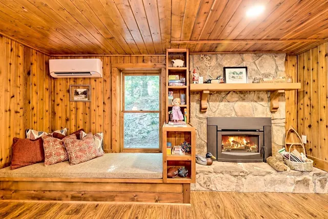 a bedroom with a bed and a fireplace